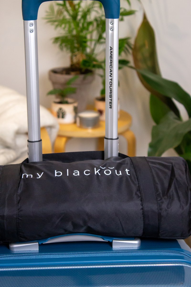 My Blackout Blind travel bag on suitcase - portable and travel-friendly